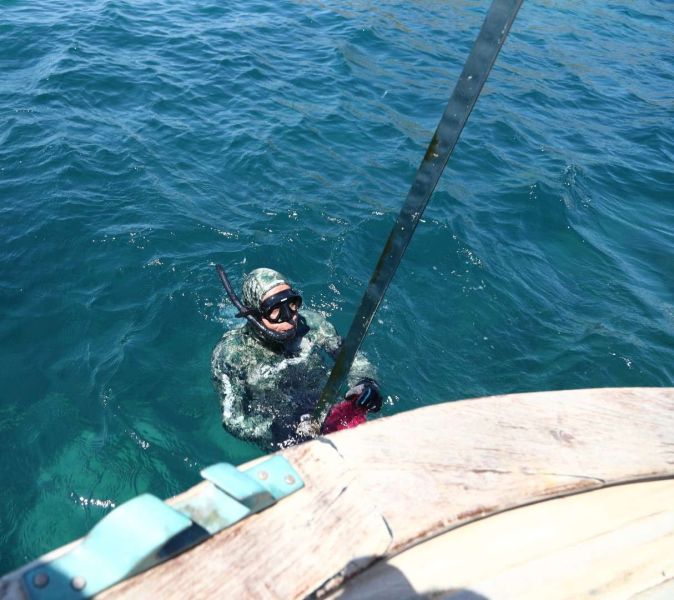 GÜMÜŞLÜK’TE DENİZ DİBİ TEMİZLİĞİ