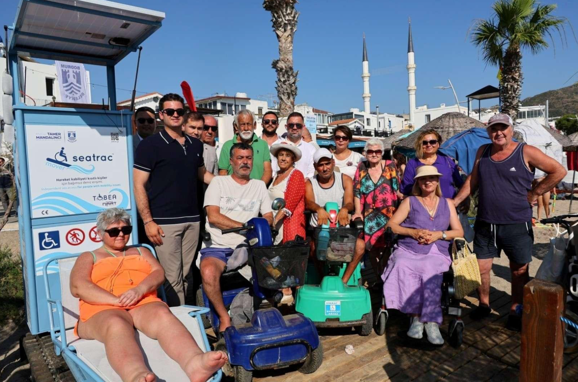 TURGUTREİS HALK PLAJINA ÖZEL GEREKSİNİMLİ BİREYLER İÇİN RAYLI SİSTEM KURDUK